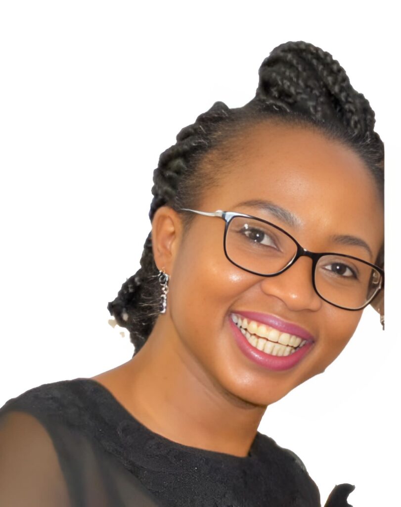 Smiling person with braided hair, wearing glasses and a black top, on a white background. Smiling person with braided hair, wearing glasses and a black top, on a white background.