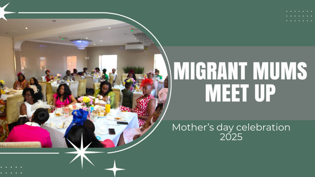 A group of women sitting at a long table decorated with flowers and colorful hats, attending an event titled "Migrant Mums Meet Up" for Mother's Day celebration 2025. The atmosphere is festive and social.